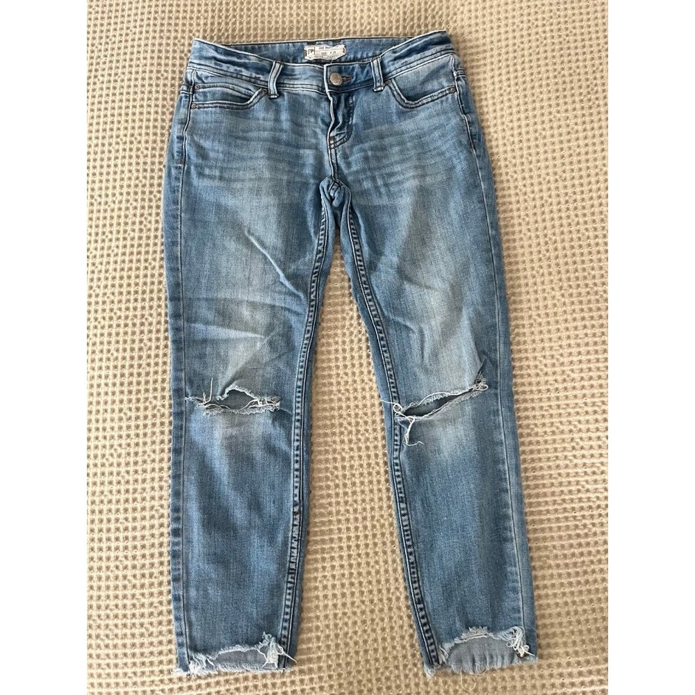 Free People busted knee shark bite jeans
